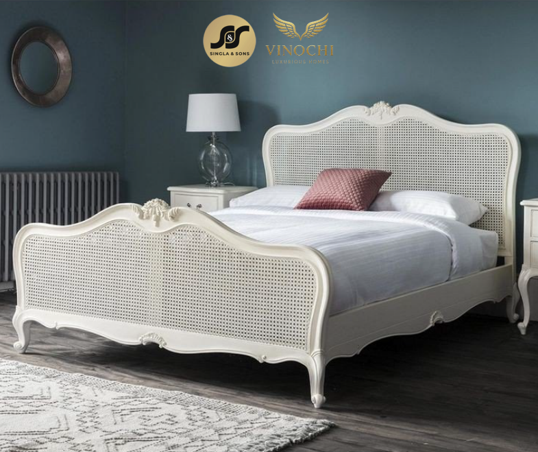 Classic cane bed in a deep blue bedroom setting