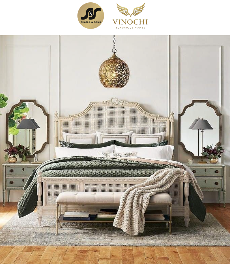 Cane bed in a bright airy room with pendant lighting